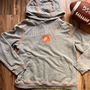 Kids gray Nike sweatshirt.